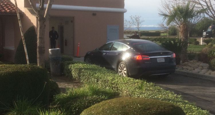 A Tesla Motors executive checks out progress at the facility.