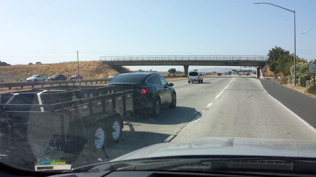 Tesla Model X hauling freight down Hwy 101