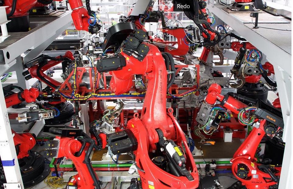 Robots on reconfigurable Tesla assembly line