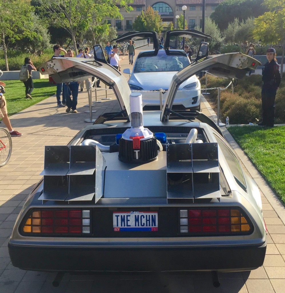 DeLorean gullwing doors vs Tesla Model X falcon wing doors at STVP Future Fest [Source: Facebook via Steve Jurvetson] 