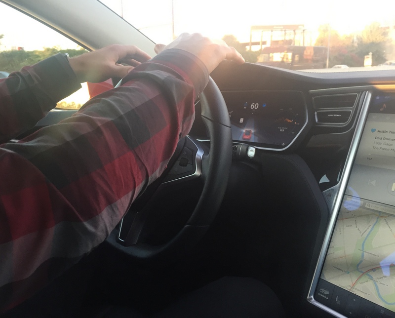 Hovering hands above steering wheel with Autopilot