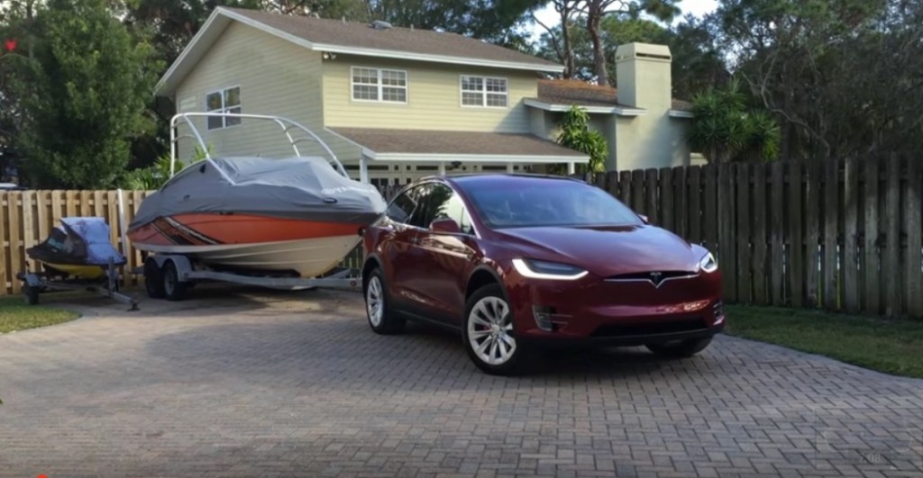 Signature Red Model X towing a 4,850 pound boat [Source: Max Kennedy via YouTube]