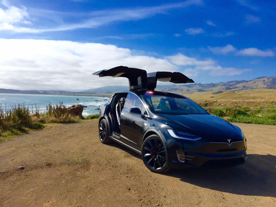 Black-Tesla-Model-X-falcon-wing-ocean-coastline