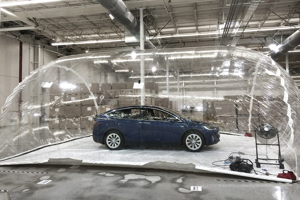 Tesla Model X testing Bioweapons Defense Model inside biohazard bubble