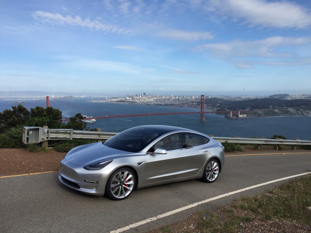 Silver Tesla Model 3 overlooking San Francisco