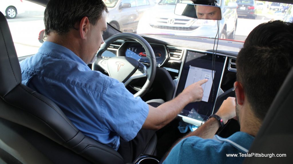 darren and joseph making adjustments to UHFS comparison car tesla pittsburgh