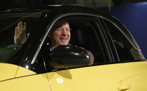 General Motors Vice Chairman, interim President of GM Europe and Chairman of the Opel Supervisory Board Steve Girsky waves as he sits inside