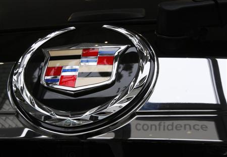 A Cadillac logo is shown at a General Motors dealership in Los Angeles