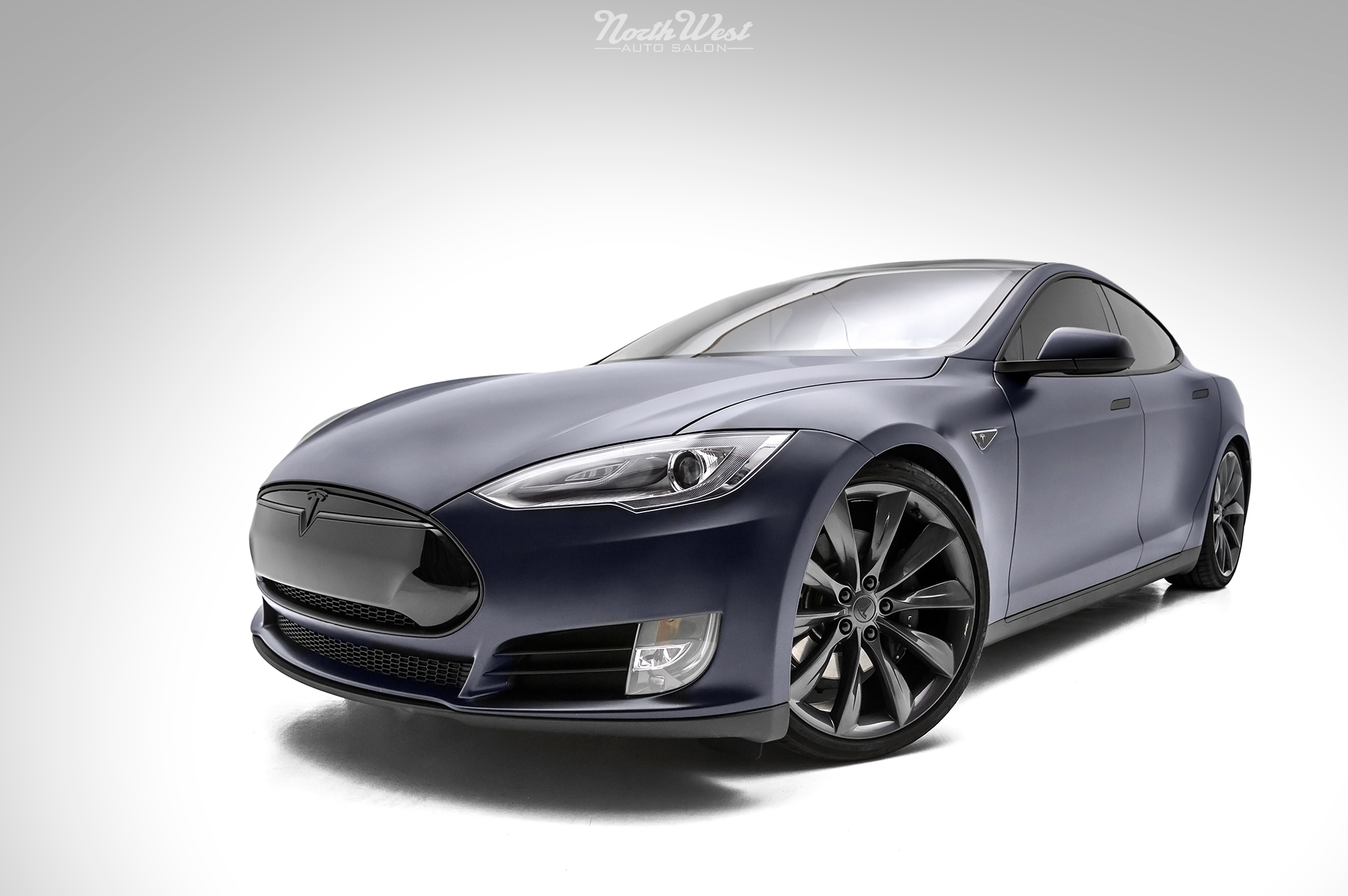 Tesla Model S Wrapped in Carbon Fiber and Stealth