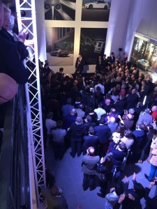 Elon Musk speaks to an audience at the Tesla store outside Paris