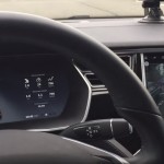 Engage Tesla perpendicular parking by putting the vehicle into (R)everse