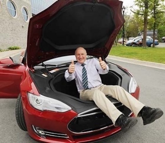 Battery expert Jeff Dahn inside the frunk of a red Model S