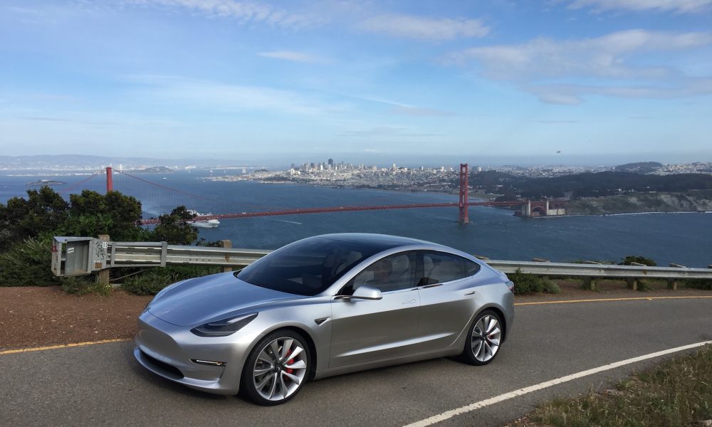 Silver Tesla Model 3 overlooking San Francisco