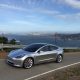 Silver Tesla Model 3 overlooking San Francisco