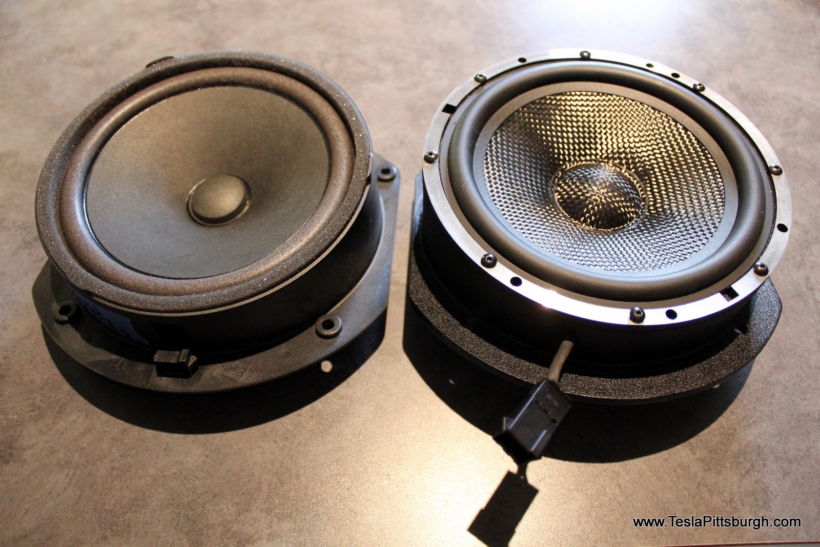 side by side of factory stock and light harmonic labs speaker tesla pittsburgh