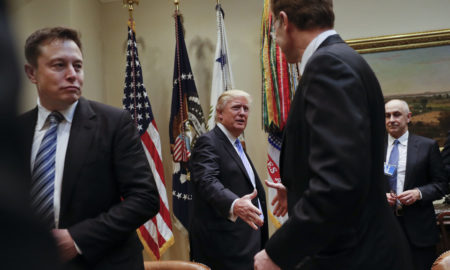 President Donald Trump greets Wendell P. Weeks, right, Chief Executive Officer of Corning, as he host breakfast with business leaders in the Roosevelt Room of the White House in Washington, Monday, Jan. 23, 2017. On the left of is Elon Musk, CEO of SpaceX and Tesla Motors. (AP Photo/Pablo Martinez Monsivais)