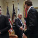 President Donald Trump greets Wendell P. Weeks, right, Chief Executive Officer of Corning, as he host breakfast with business leaders in the Roosevelt Room of the White House in Washington, Monday, Jan. 23, 2017. On the left of is Elon Musk, CEO of SpaceX and Tesla Motors. (AP Photo/Pablo Martinez Monsivais)