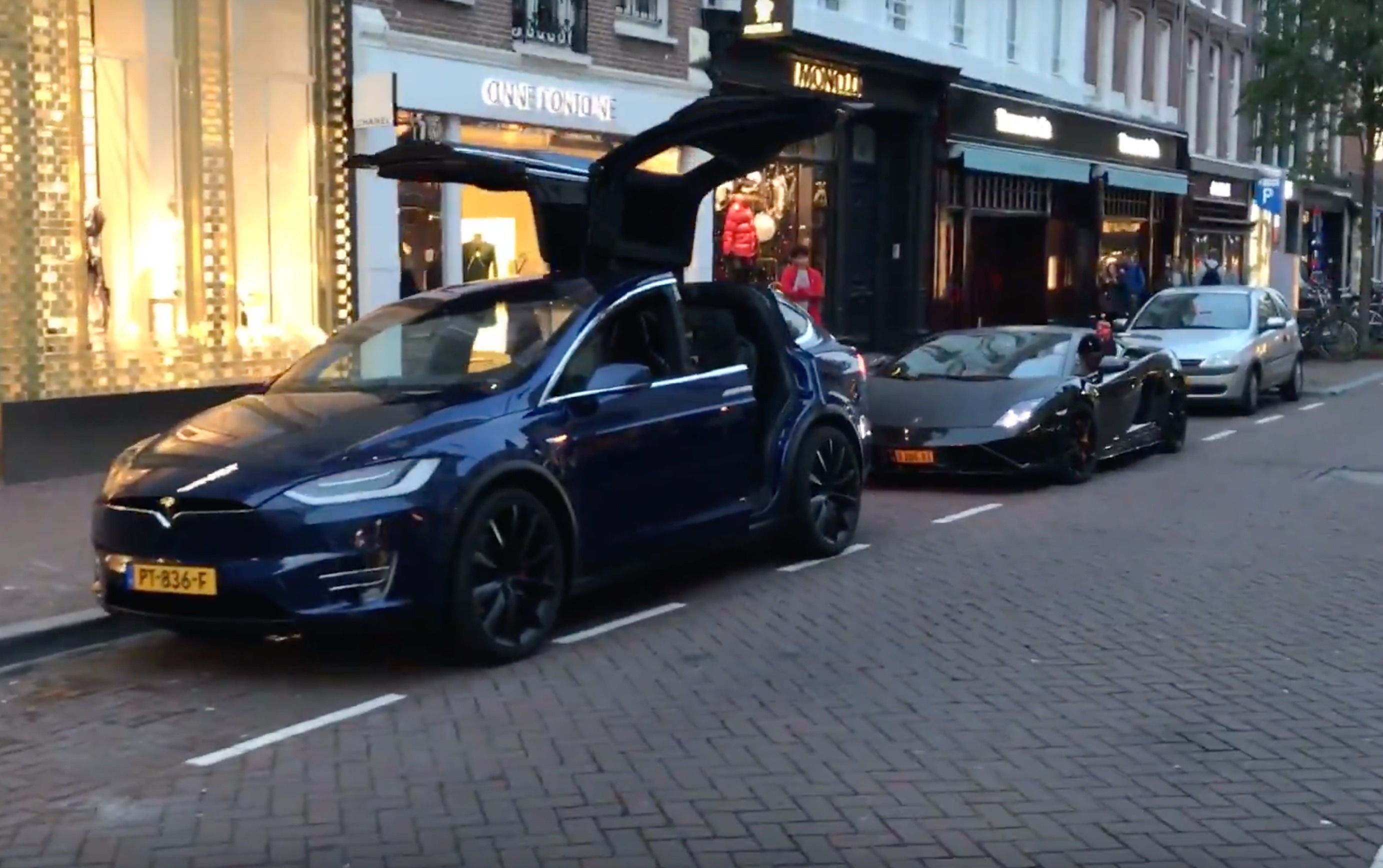 Watch this Tesla Model X steal a Lamborghini's a song and dance