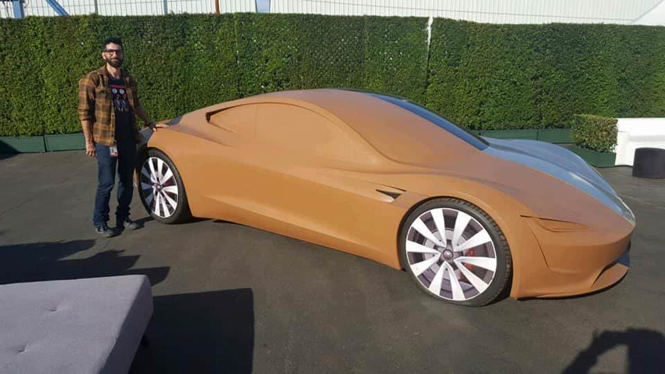 Tesla Roadster behind closed curtains at the Hawthorne Design Center