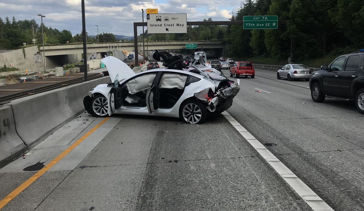 Wrecked Model 3 on highway I-90
