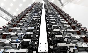 A stack of 60 Starlink v0.9 satellites are prepared for their orbital launch debut in May 2019. (SpaceX)