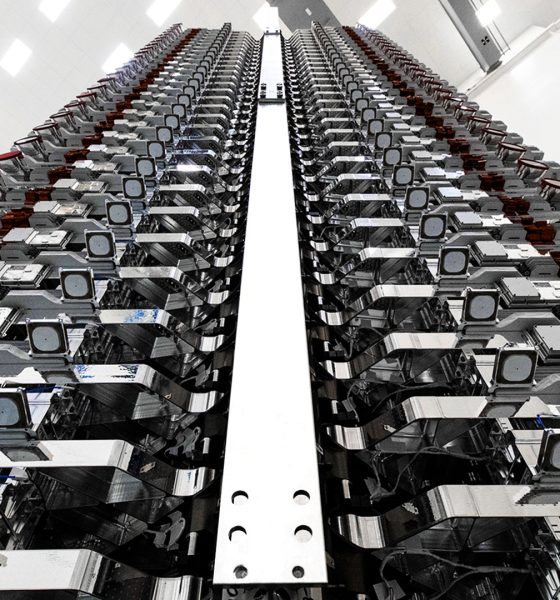 A stack of 60 Starlink v0.9 satellites are prepared for their orbital launch debut in May 2019. (SpaceX)