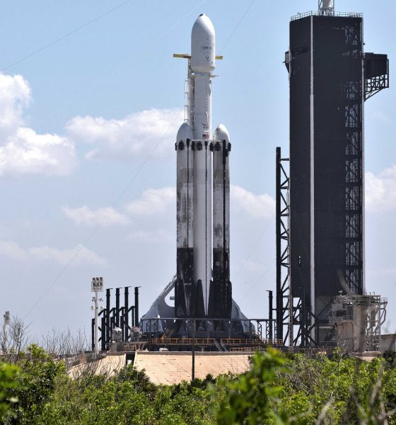 Falcon Heavy Flight 3 made use of both flight-proven side boosters and a new center core. Note the scorched landing legs and sooty exteriors. (SpaceX)