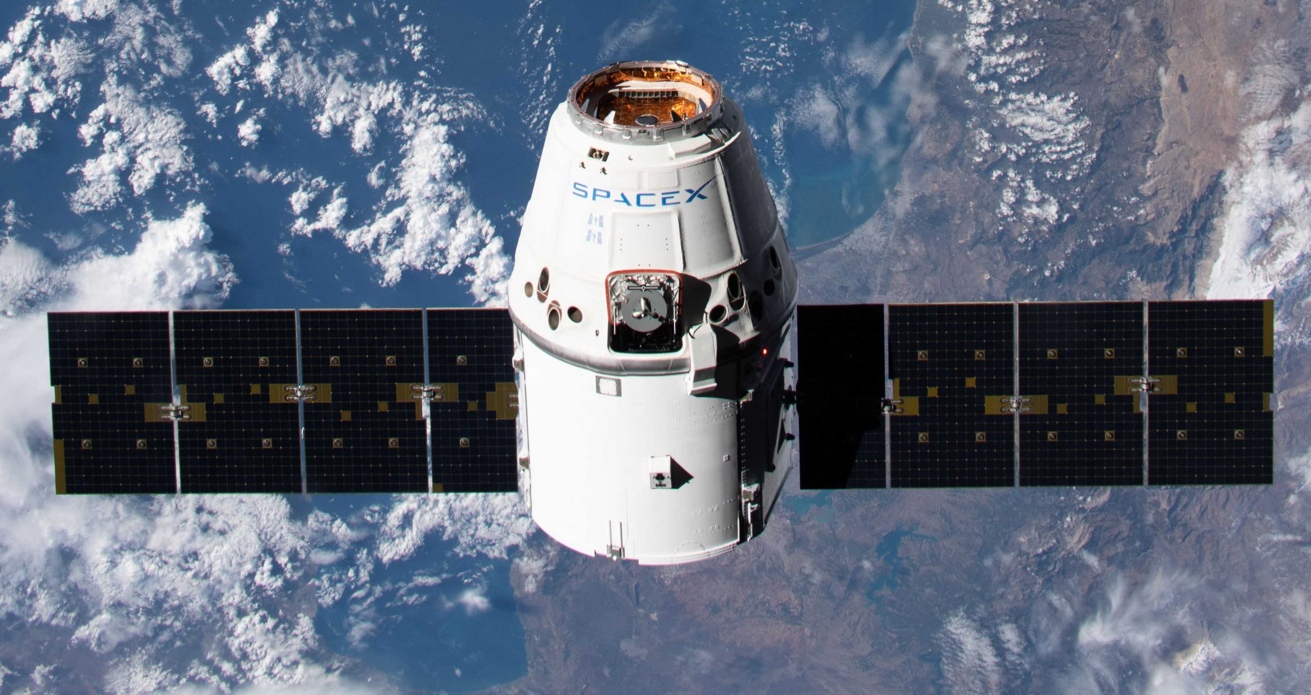 SpaceX Cargo Dragon spacecraft arrives at space station on ...