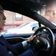 Andrew Yang behind the wheel of a Tesla Model X (Credit: Andrew Yang)
