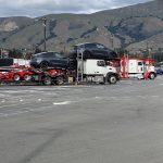 Tesla Model Y being loaded onto car carriers at the Fremont factory