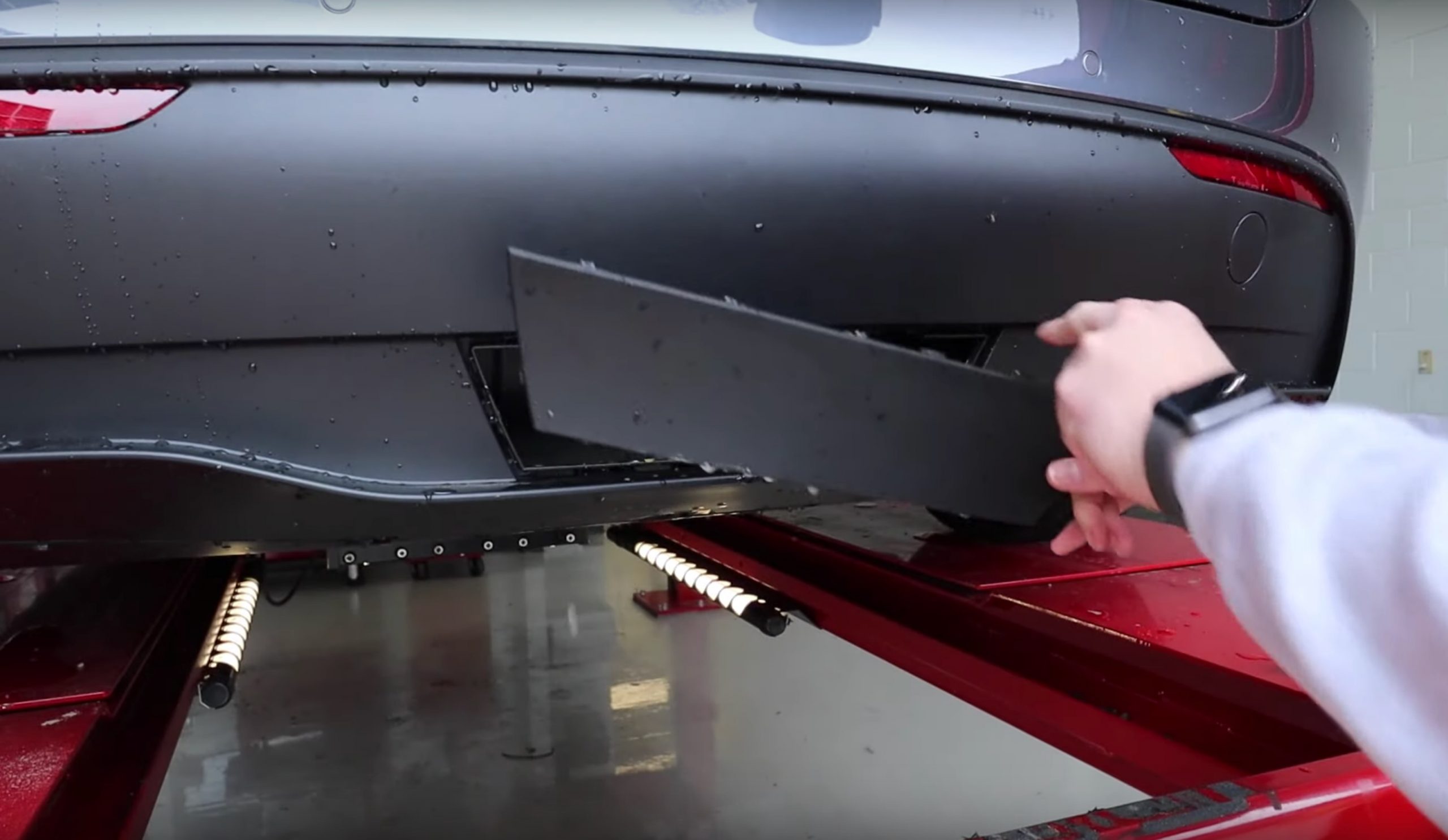 Tesla Model Y trailer hitch cover plate reveals room for towing down the  road