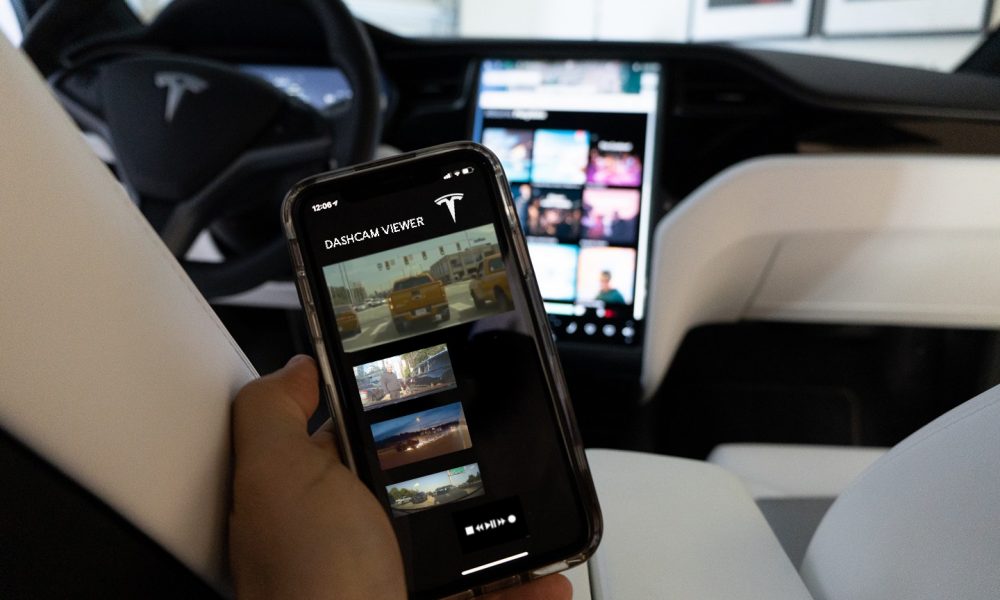 Concept image of a Tesla mobile app accessing Sentry Mode footage