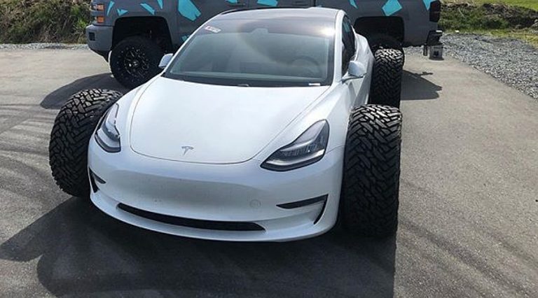 Tesla owner ditches snow tracks for monstrous truck tires this time