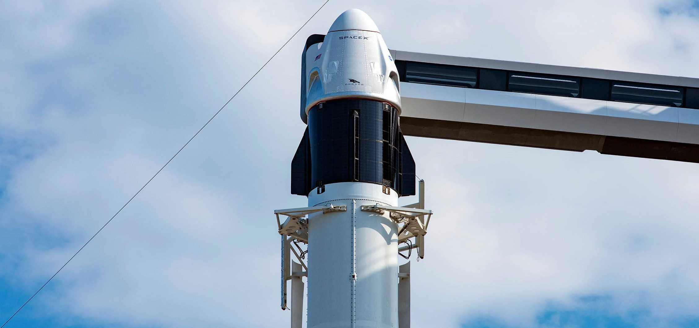 https://www.teslarati.com/wp-content/uploads/2020/05/Crew-Dragon-C206-F9-B1058-Demo-2-39A-052120-SpaceX-rollout-3-crop-2-c.jpg