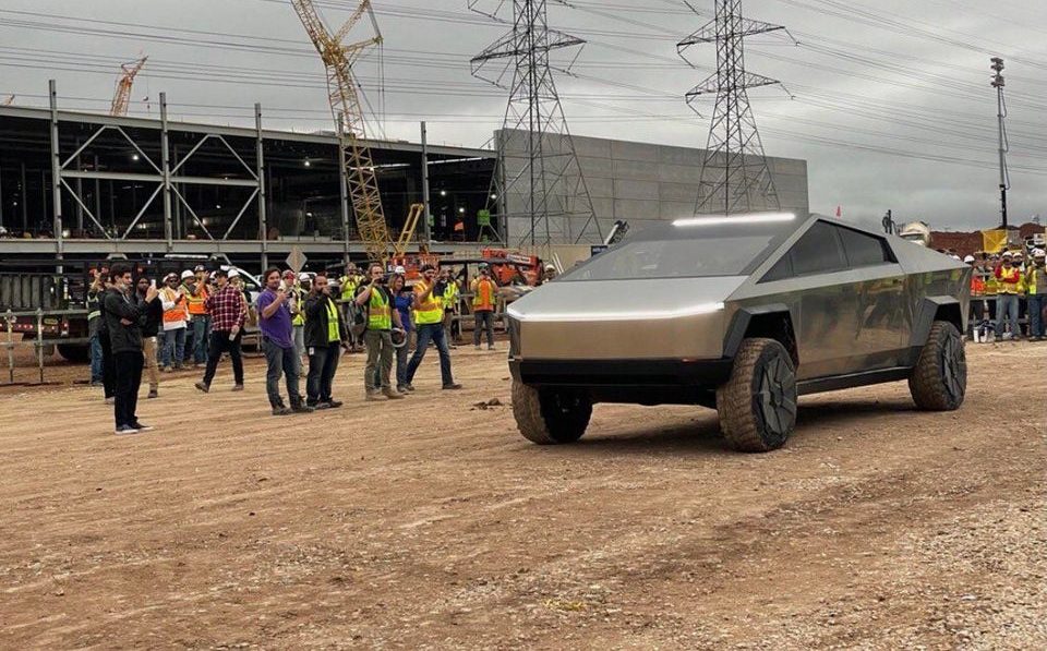 photo of Tesla Cybertruck pays visit to Gigafactory Texas with Elon Musk behind the wheel image