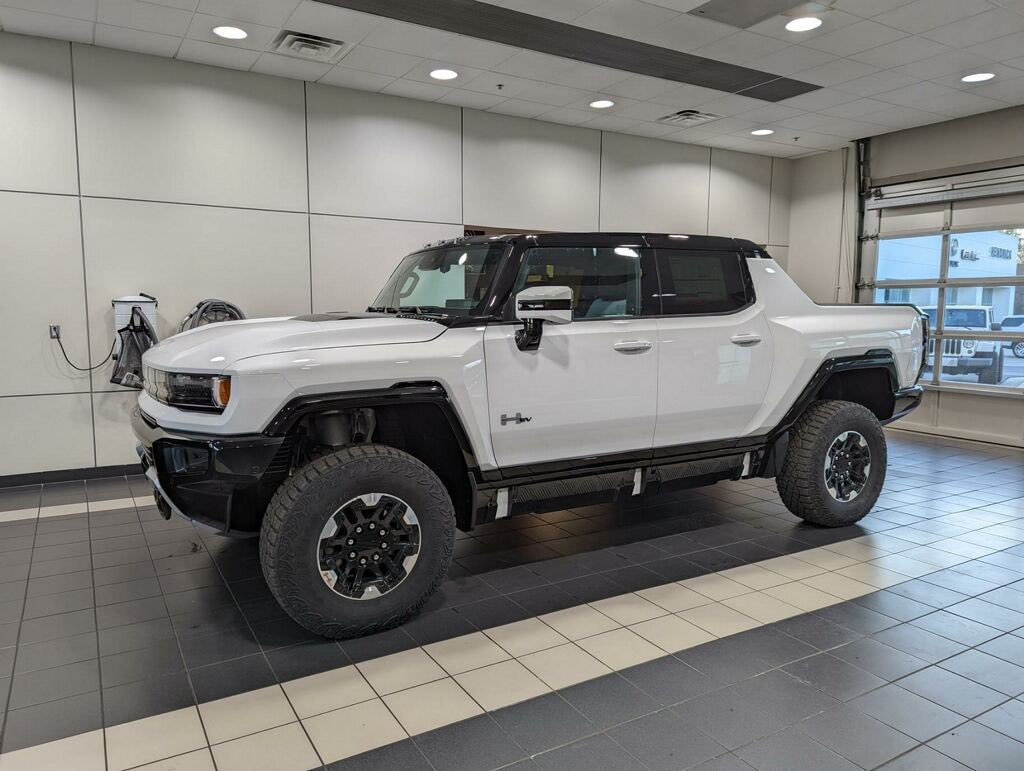 GMC Hummer EV sports its massive size alongside full-size SUV