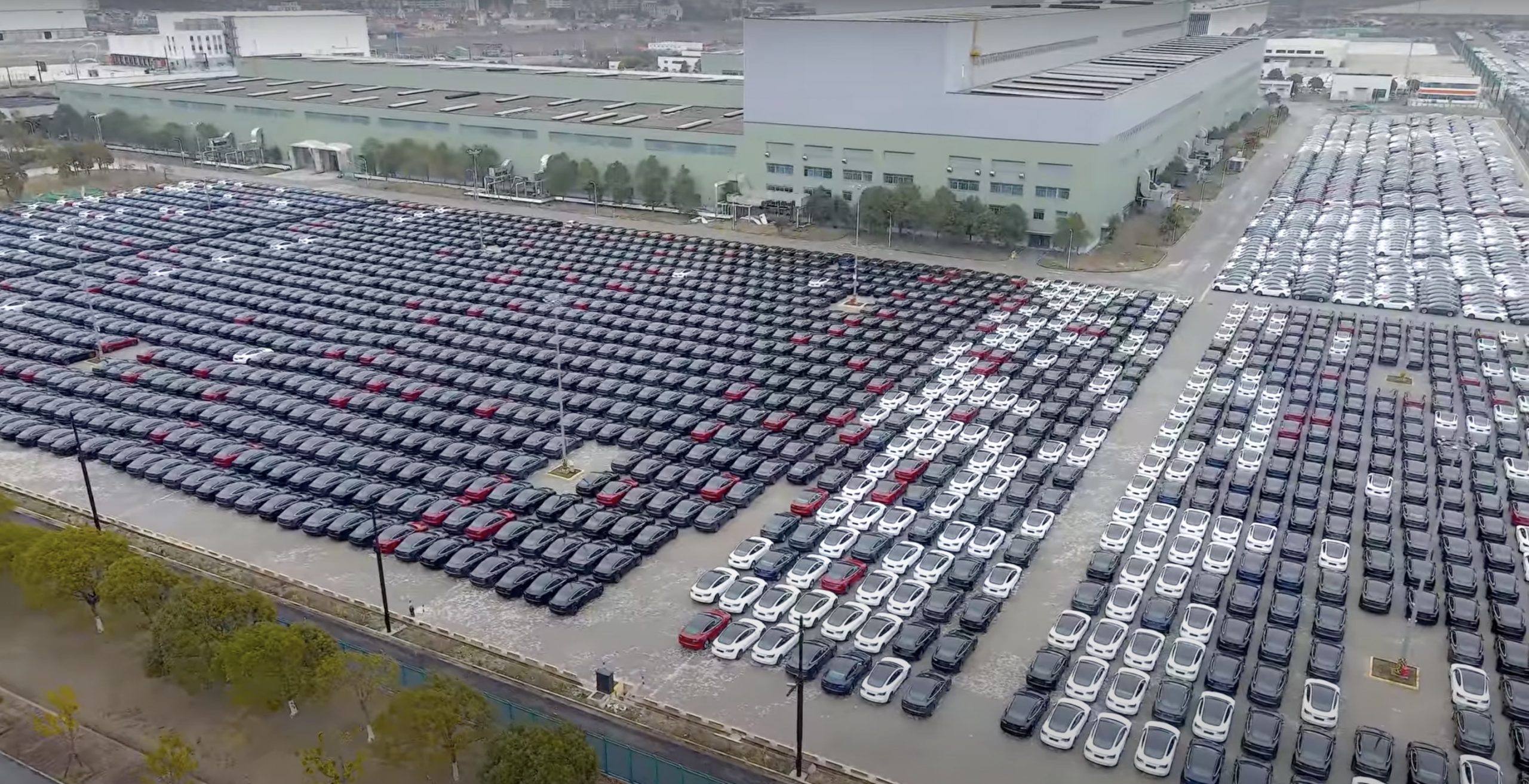 Large parking lot of new cars waiting for delivery and export, at