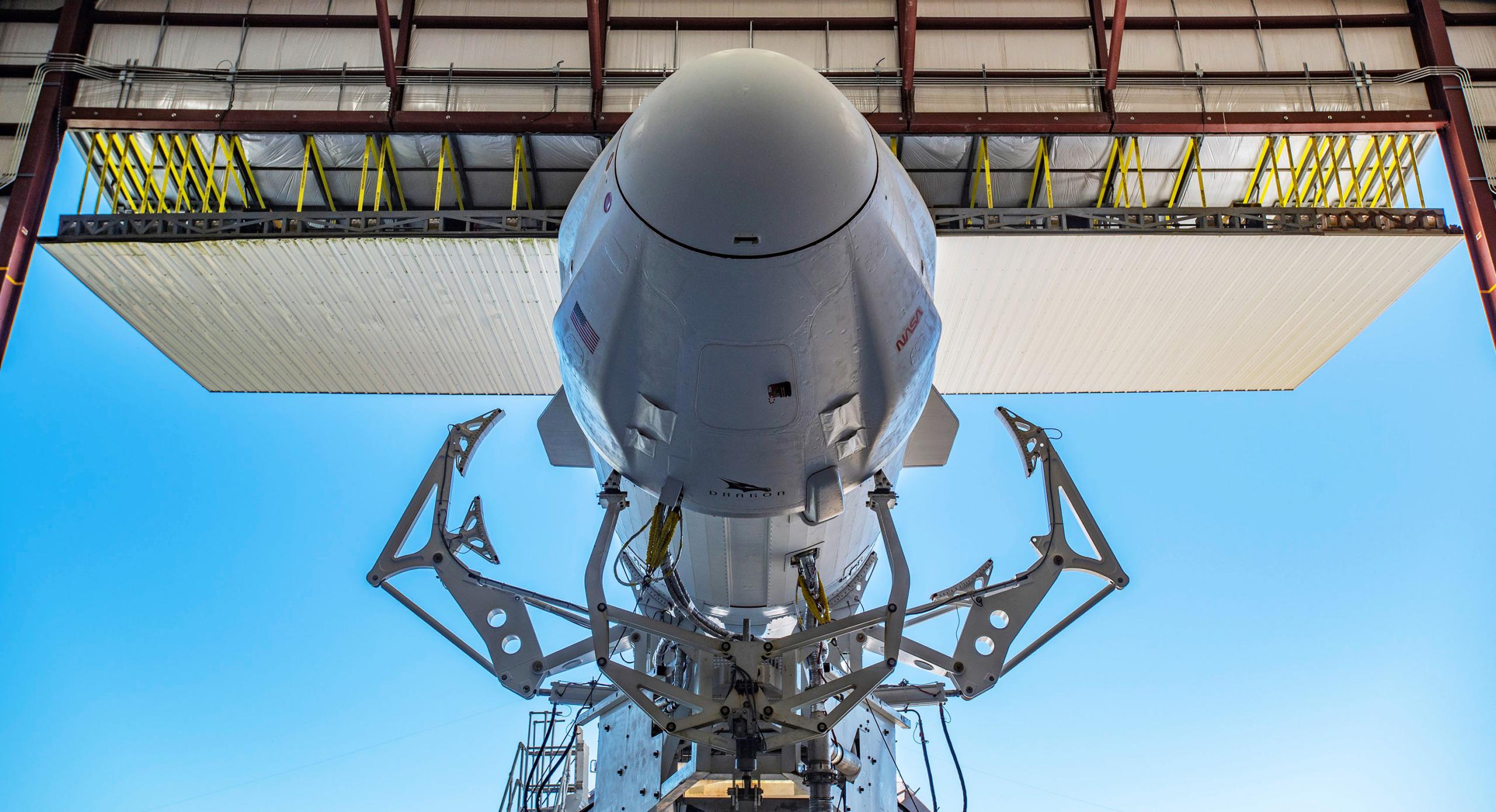 CRS-25 Dragon C208 F9 B1067 39A 071222 (SpaceX) rollout 4 crop (c)