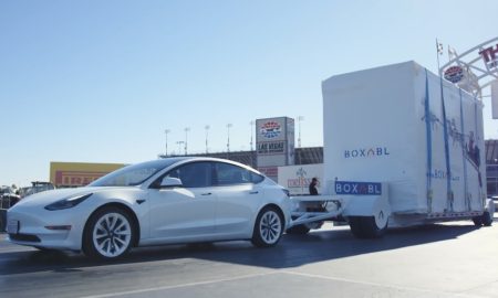 Tesla Model 3 tows a Boxabl house