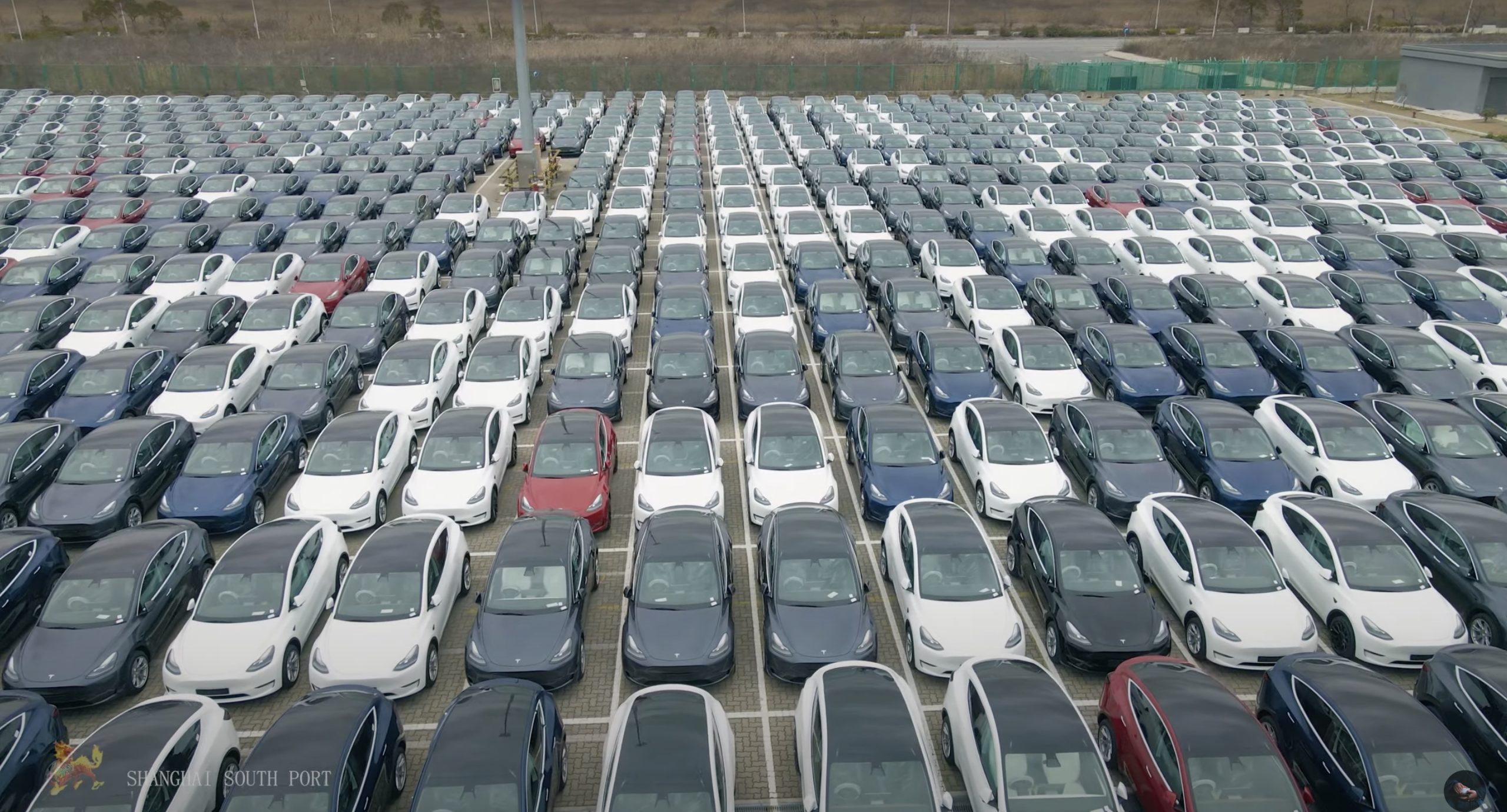 Large parking lot of new cars waiting for delivery and export, at