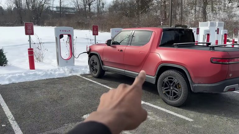 rivian charging at tesla supercharger