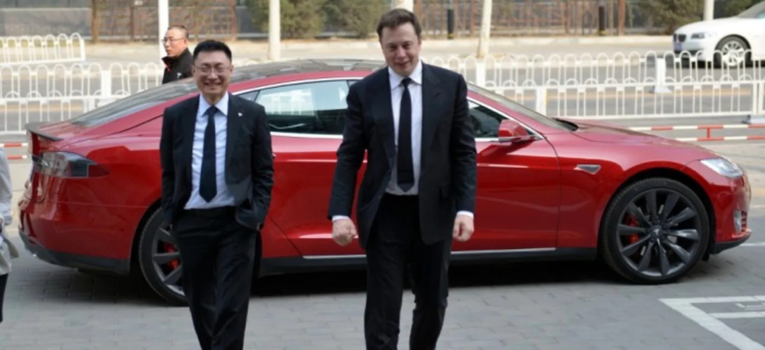 Elon Musk and Tom Zhu