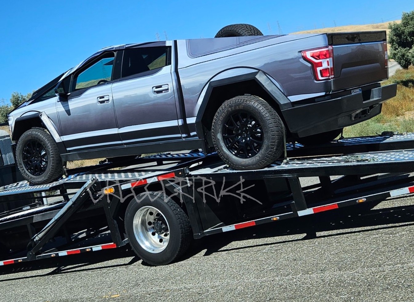 tesla cybertruck wrapped as an f-150