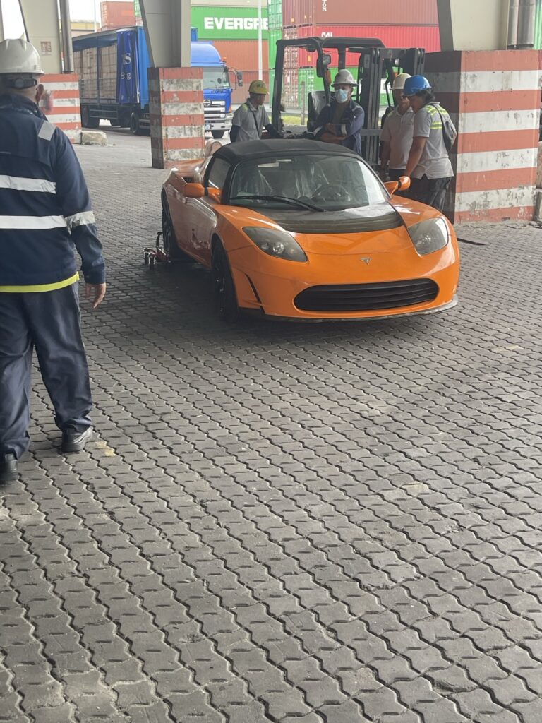 tesla-roadster-removed-china-abandoned-crate