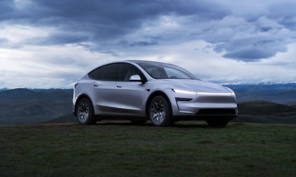 Tesla Model Y L in a field