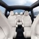tesla model y l interior looking back showing all six seats