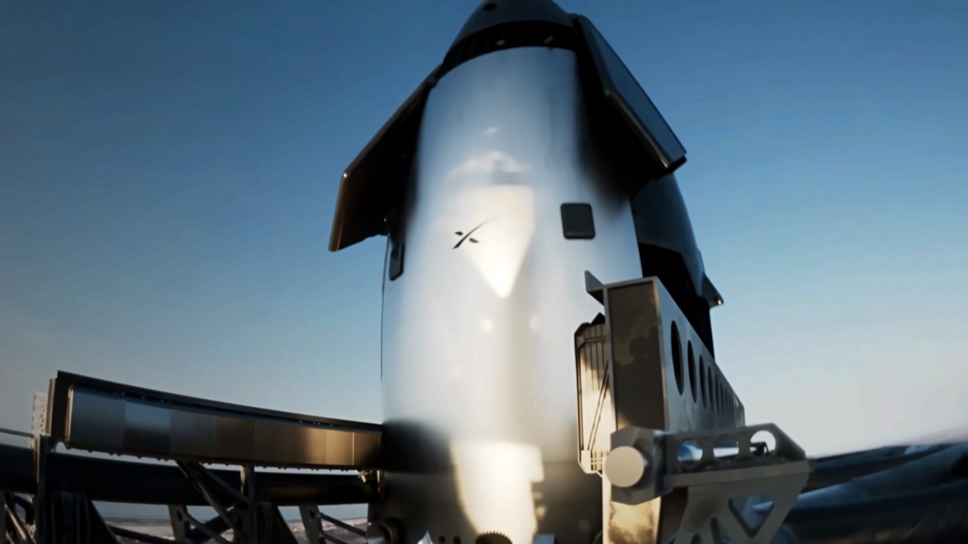 Concept video of SpaceX’s Flight 15 Starship held in the launch tower’s chopstick arms after a catch. (Credit: SpaceX)