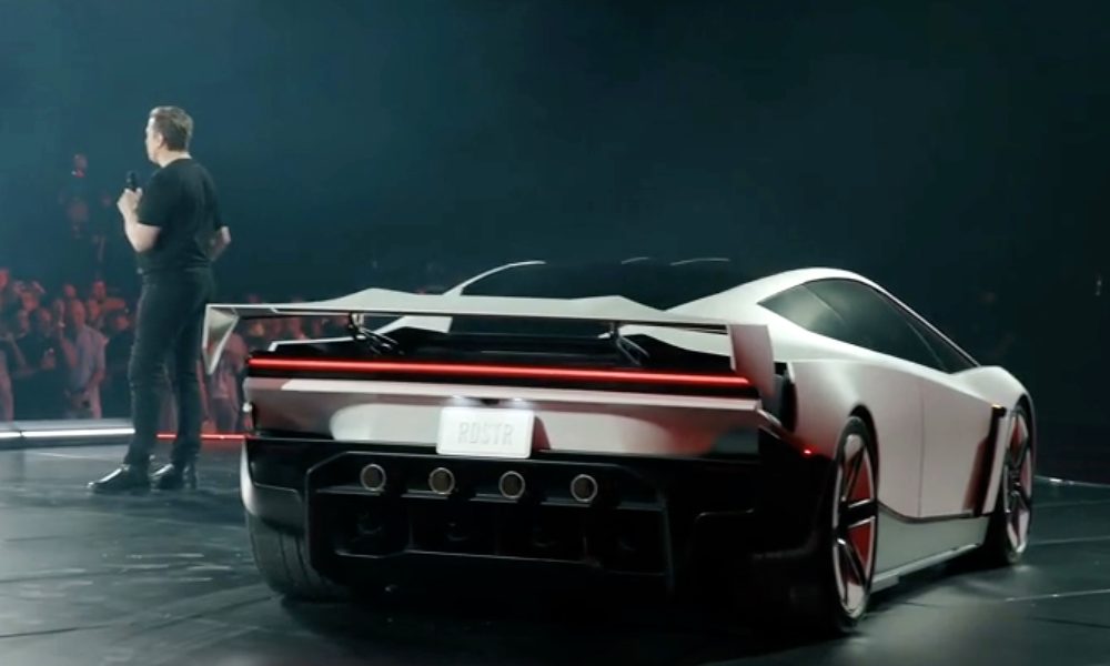 Elon Musk addresses the crowd next to the new Tesla Roadster, which Tesla offers in Performance, Thrust and Rocket versions. (Image: Tesla/X)