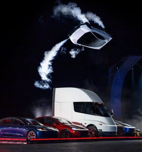 Tesla’s new Roadster, upside down and trailing cold gas thruster smoke, flips over a lineup of Tesla vehicles at the Roadster unveiling near Waco, Texas on October 15, 2026. (Image: Tesla)