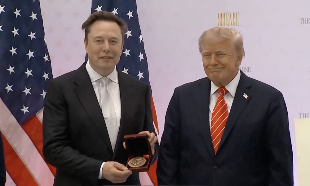 Elon Musk holds the National Medal of Science alongside President Donald Trump at the “Science: A New Golden Age” summit in Washington on October 8, 2026.